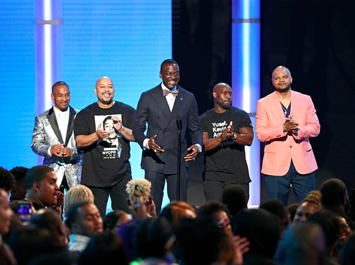 Central Park Five Korey Wise, Raymond Santana Jr., Yusef Salaam, Antron McCray, and Kevin Richardson speak onstage at the 2019 BET Awards