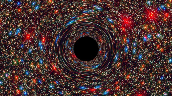 Black Hole Rendering This computer-simulated image from NASA predicts what a supermassive black hole at the center of a galaxy may look like.
