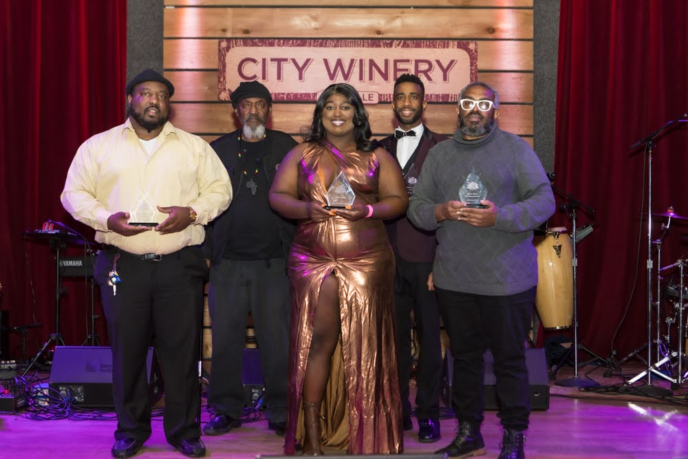 Poets Frank "Frizzy" Sykes, Khaos "No B.S." Thomas, Alexis Wolfe, Cameron Mitchell, and Black Atticus holding their awards.