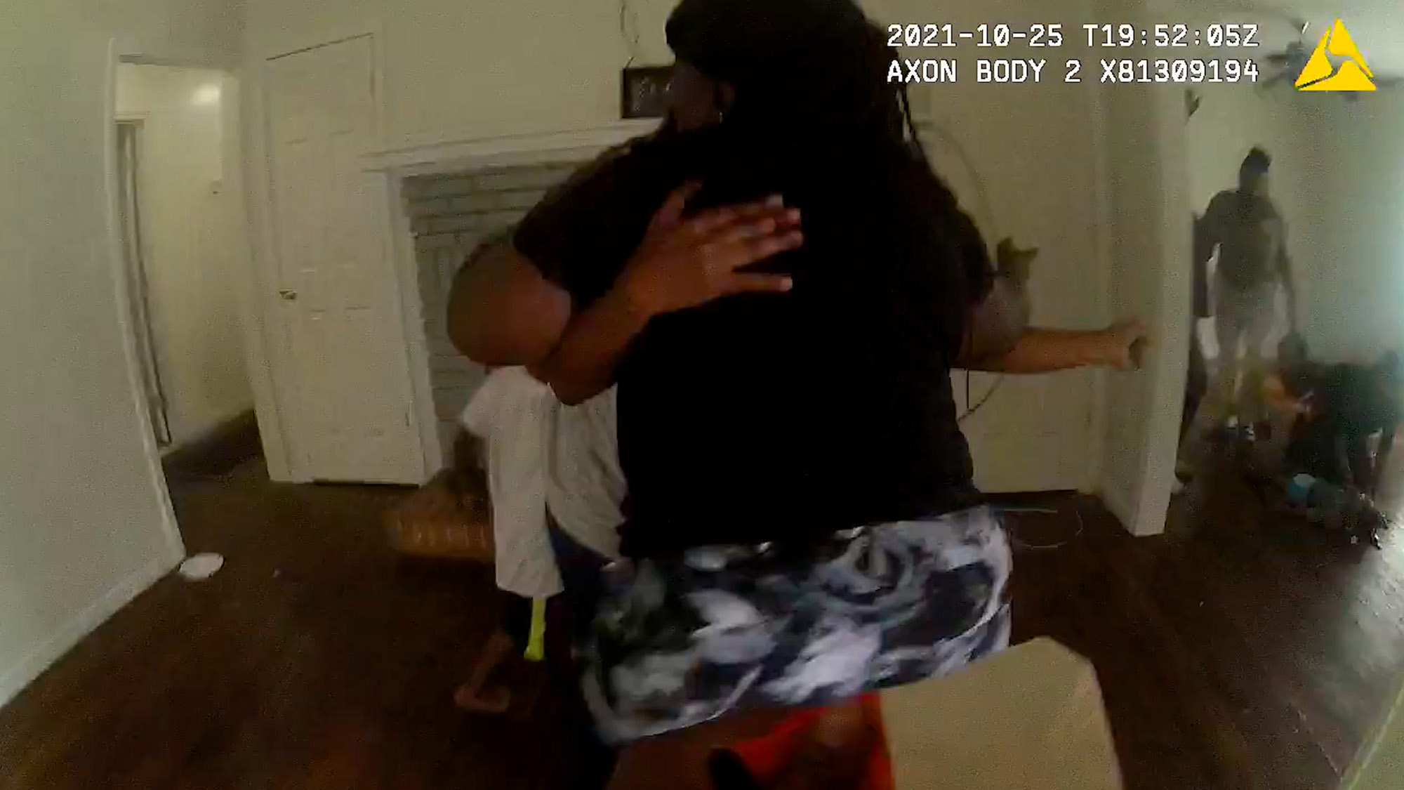 In this screenshot from a video, two women scream as a deputy enters the home where an unresponsive year-old child lies on the floor, in Fairfield in Alabama. (Jefferson County Sheriff's Office/Zenger)