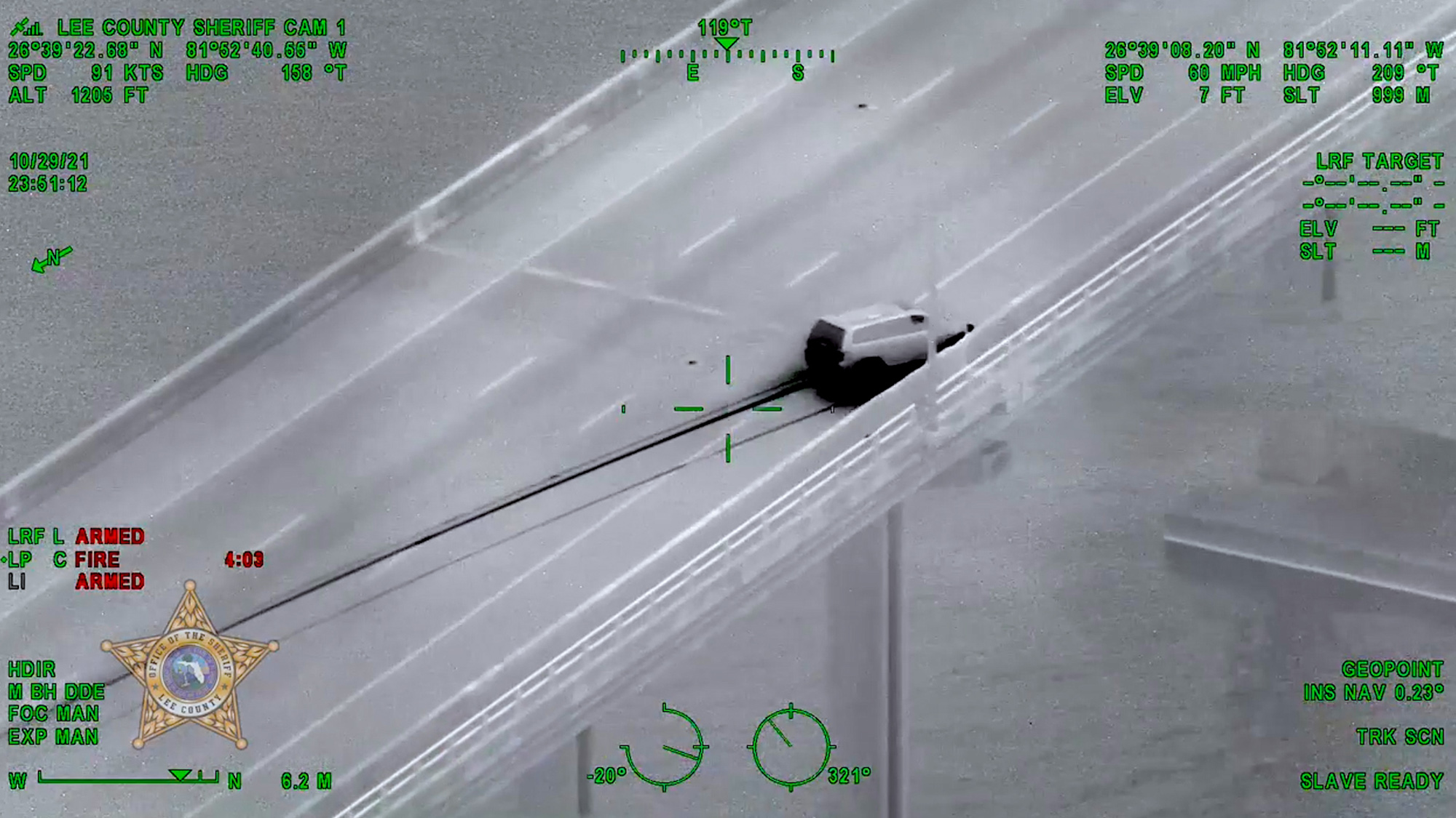 The suspect, identified by police as Bryan Gray, is seen driving the van and hitting the guard rail on the Edison Bridge in Lee County, Florida, on Oct. 30. (Lee County Sheriff's Office/Zenger)