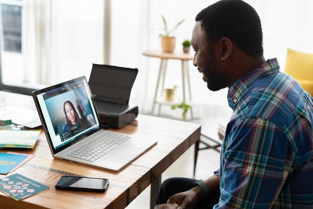 Salesperson using software to attend a meeting.