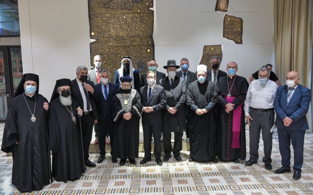 Israeli President Isaac Herzog, center, government officials and religious leaders call for mass COVID vaccinations during a meeting in Jerusalem. (Koby Gideon/GPO)