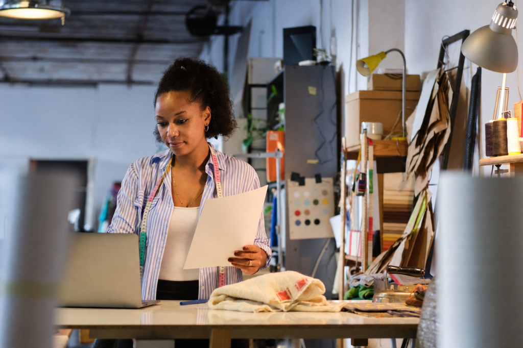 Black woman entrepreneur working in textile workshop