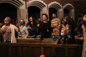 An audience enjoys May's An Evening of Healing Sounds, Poetry, and Prayer at Wightman Chapel on Scarritt Bennett Center's Campus (Photo by: Alpha Artistry Films)