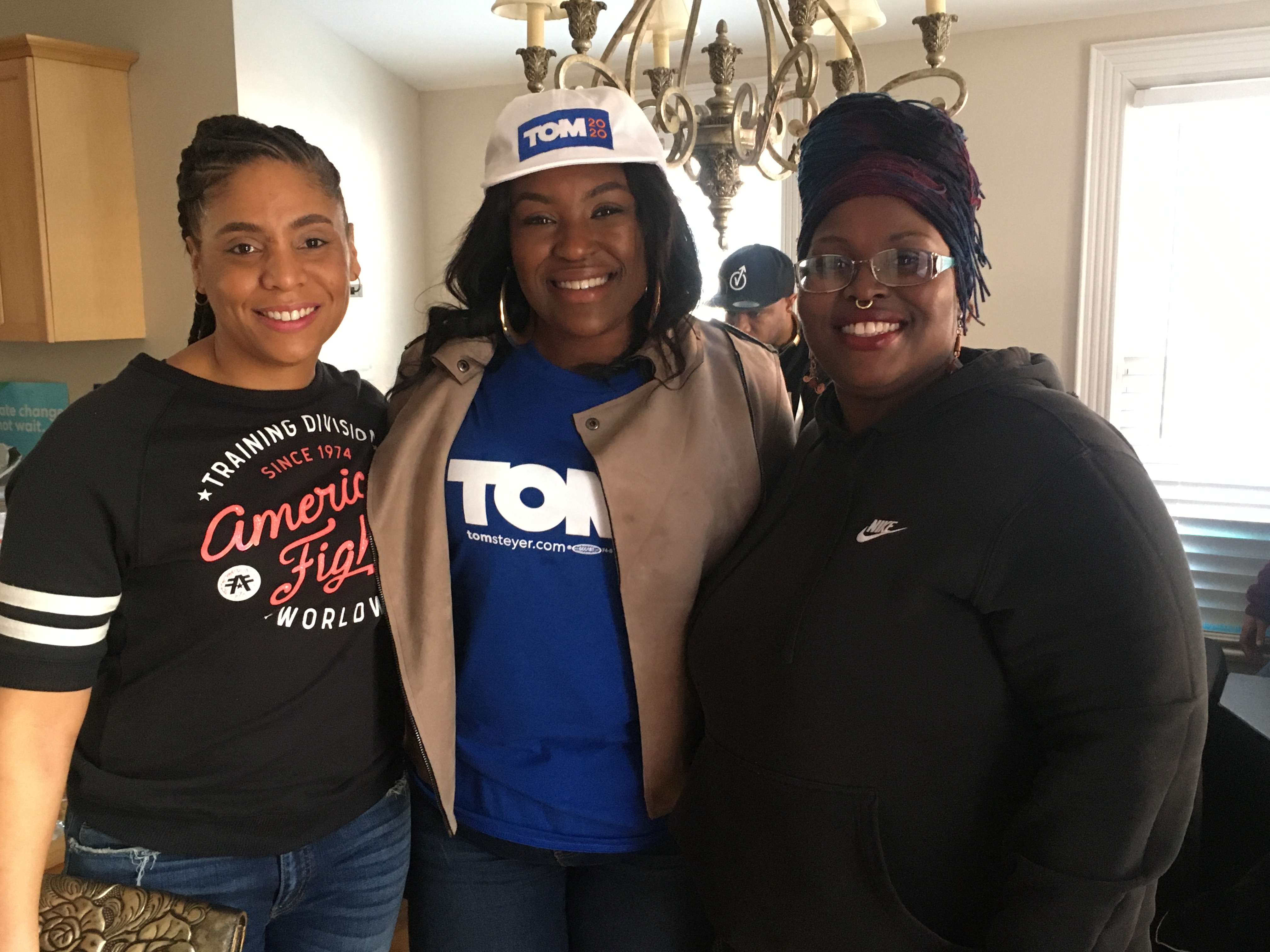 Steyer TN State Director Tequila Johnson (Center) with two Nashville voters. (Photo by: Issac Freeman)