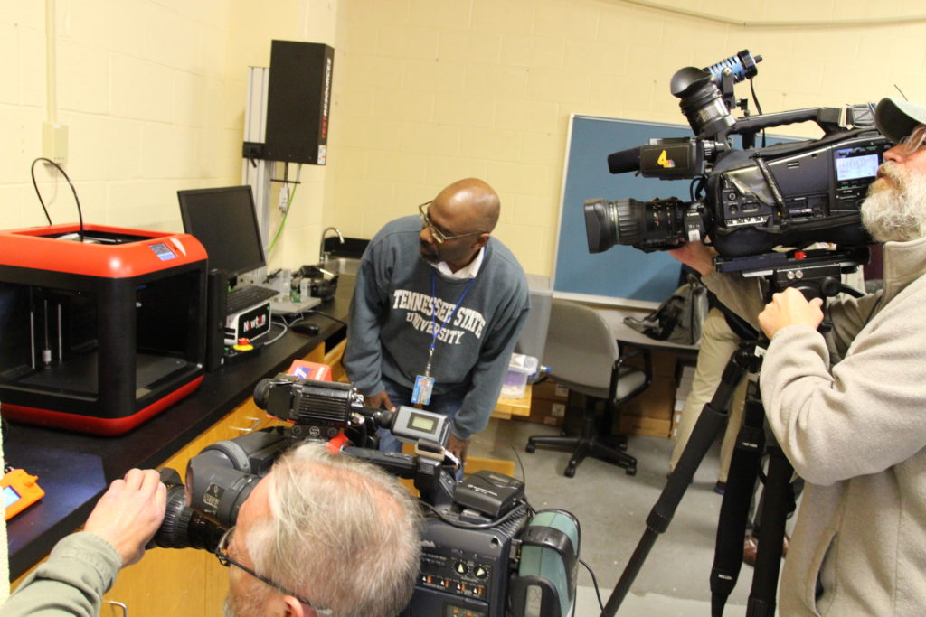 Dr. S. Keith Hargrove, dean of TSU’s College of Engineering, showcases one of the College’s 3D printers to reporters. Inset photo, headband designed by TSU 3D printing machines. (Photo by: Emmanuel Freeman | TSU Media Relations)