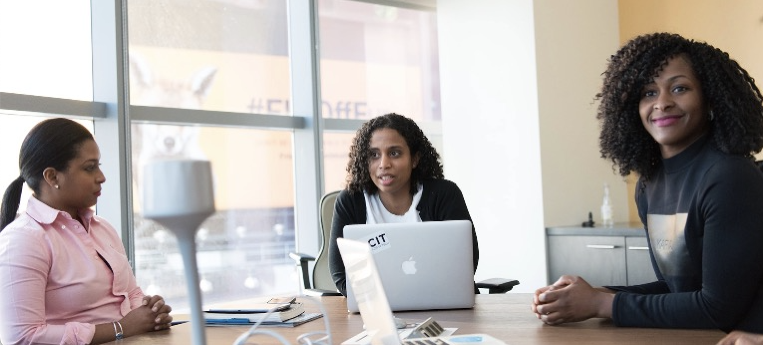 Three women in an office space