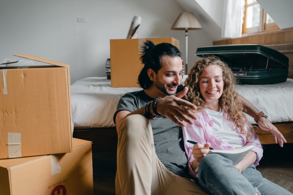 People smiling while planning their relocation.