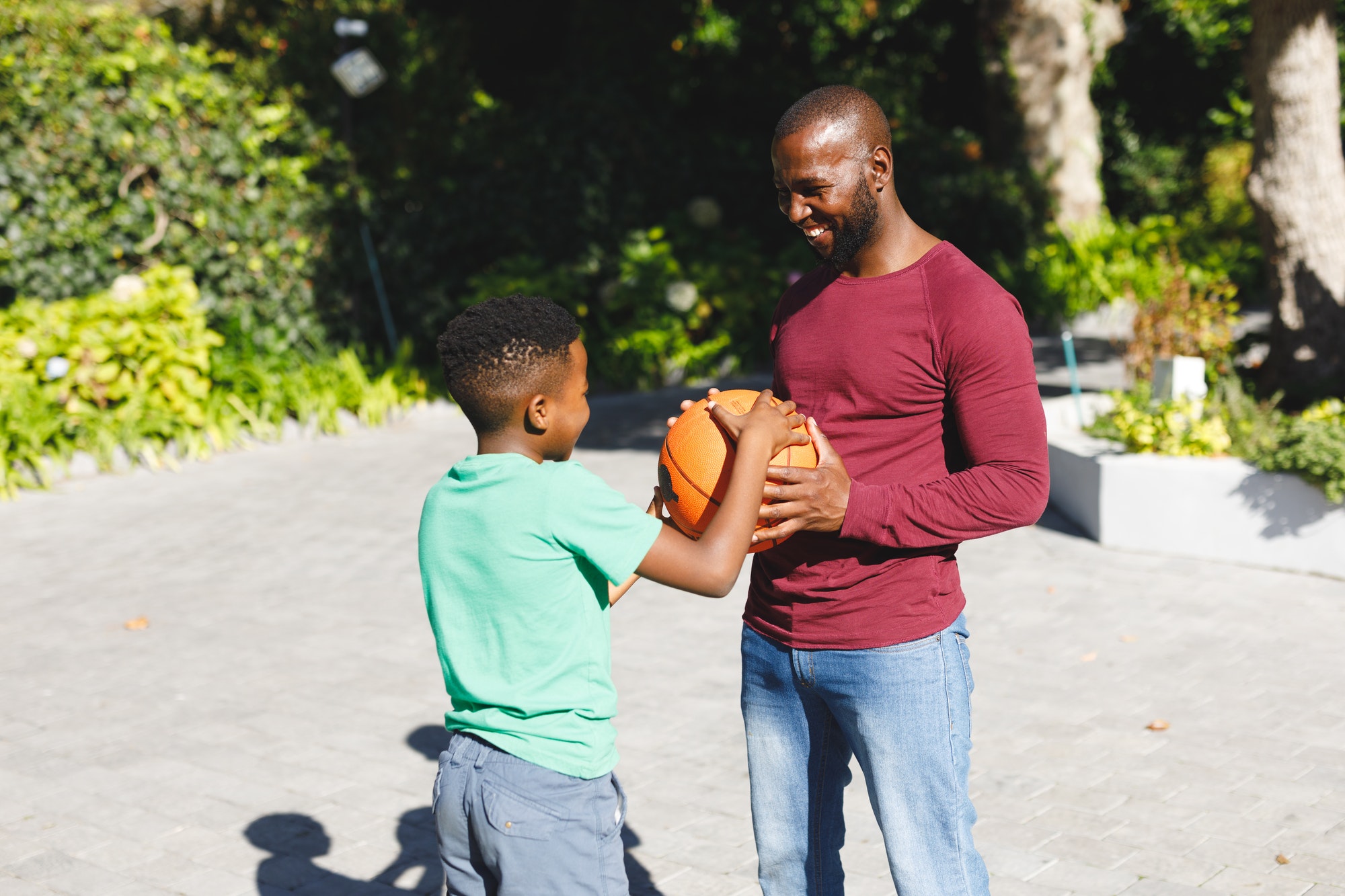 A Big and his Little playing basketball