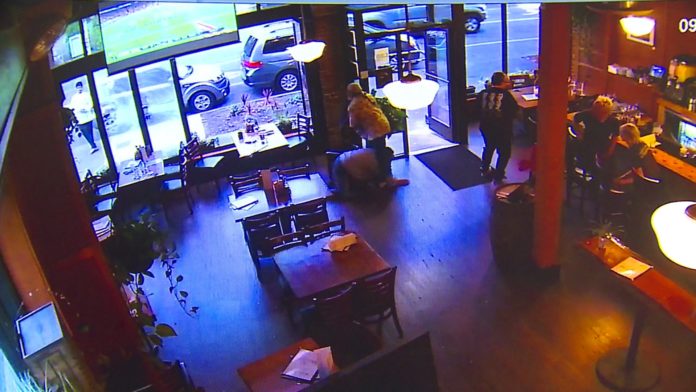 capture-1 Security video shows man smashing restaurant windows with rocks... with people inside. (Source: KCPQ, Tribune, Colin Pickering)