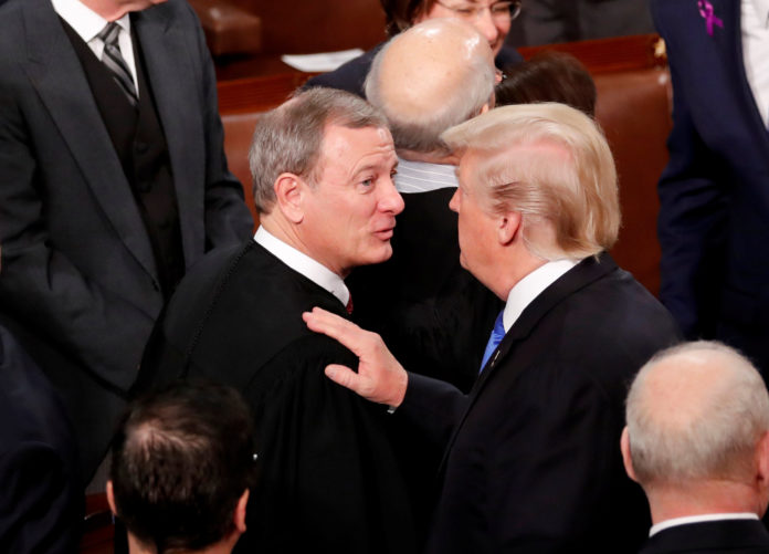 FILE PHOTO: U.S. President Trump greets Justice Roberts after delivering his State of the Union address in Washington