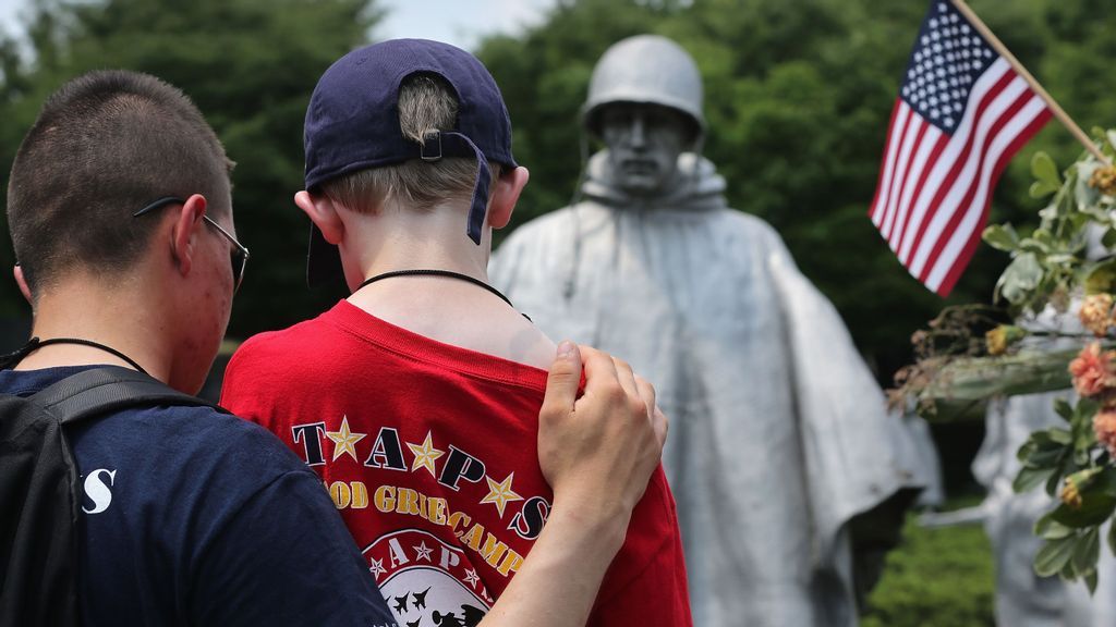 The son of a fallen Iraq war soldier visits the Korean War Memorial during a “Good Grief Camp” outing in May 2021. (John Moore/Getty Images)
