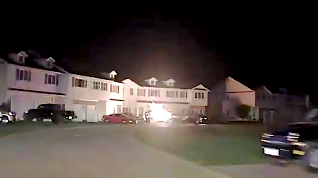 Police car dashcam captured the moment two suspects bailed out of a moving vehicle before it crashed into a residence in Medina, Ohio, on Oct. 6. (Medina Police/Zenger)
