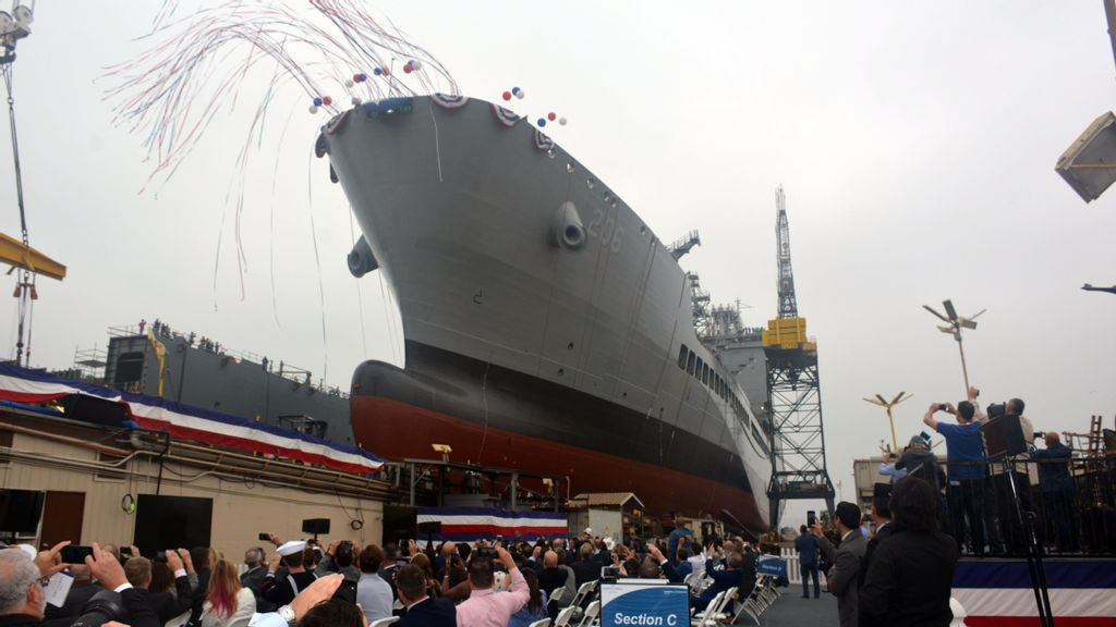 The new U.S.N.S. Harvey Milk slides into the water during its christening ceremony at General Dynamics' NASSCO yard in San Diego. The ship honors Navy veteran and LGBT activist Harvey Milk, one of the first openly gay candidates elected to public office. (Sarah Burford, U.S. Navy)
