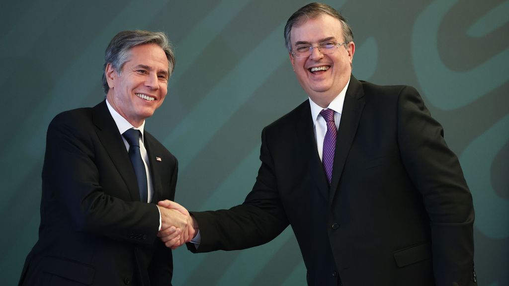 U.S. Secretary of State Antony Blinken (left) and Mexican Foreign Minister Marcelo Ebrard (right) shake hands during a conference as part of the High-Level Security Dialogue at SRE Building on October 8, 2021, in Mexico City. (Photo by Hector Vivas/Getty Images)