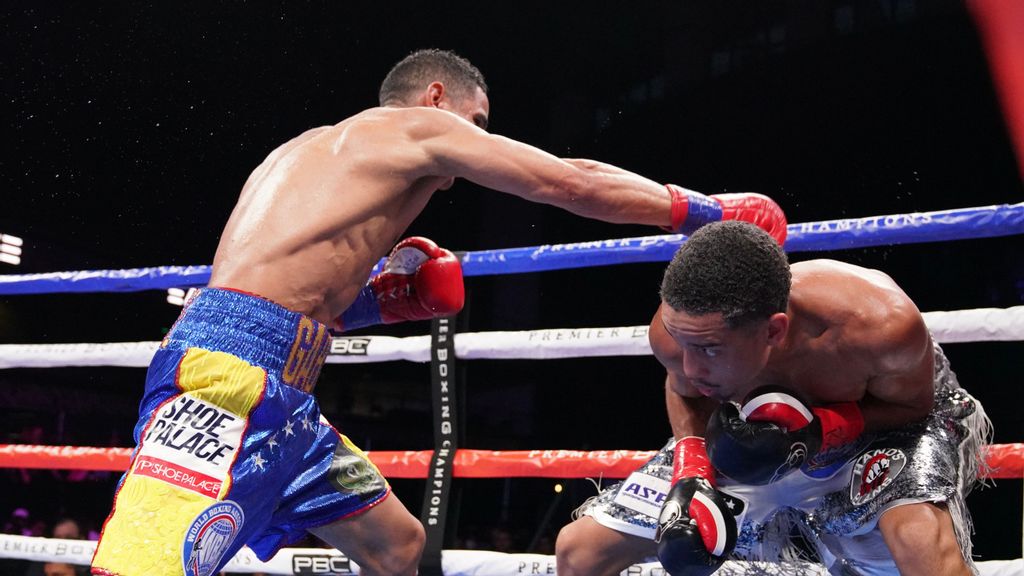 This right hand of Gabriel Maestre (left) misses Mykal Fox, who was told by former heavyweight champion Lennox Lewis, “Bro, you won that fight.” (Sean Michael Ham/TGB Promotions)