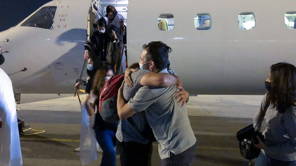 Afghan girls leaving their plane. Forty-two women, girls and family members were spirited out of the country to the United Arab Emirates in September. (Boaz Arad/IsraAID)