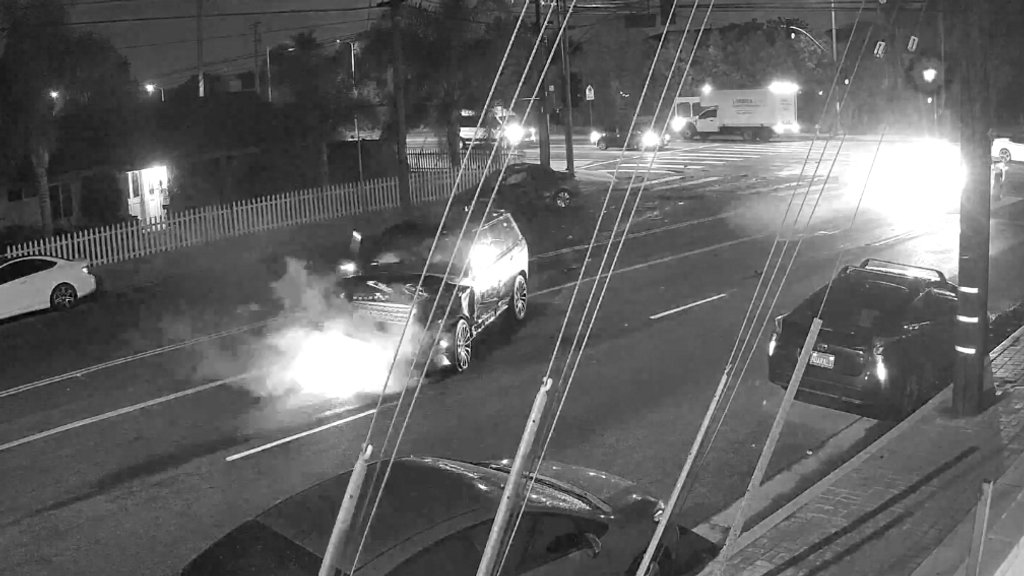 Los Angeles Police are hunting for two suspects whose vehicle ran a red light and smashed into several cars, killing a woman in one of them on Oct. 5, 2021. (LAPD/Zenger)
