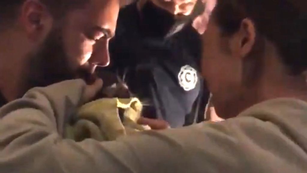 Firefighters cut a hole in the ground of a burnt property to rescue the owner’s cat on Nov. 3. The animal had been trapped in a hole three days after a fire in Brisbane, Australia. (Queensland Fire and Emergency Services/Zenger)