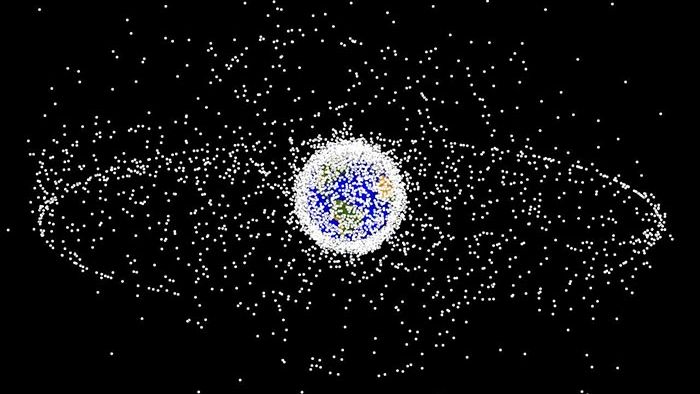 Thousands of soft-ball size objects orbit the Earth, as seen from an oblique vantage point. (NASA Orbital Debris Program)