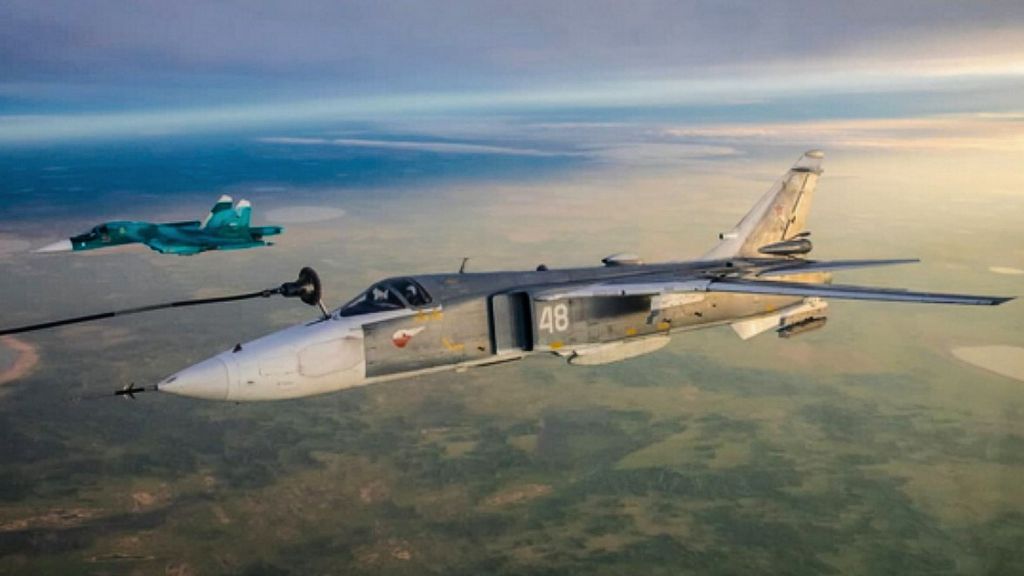 The Russian jet in the foreground has a fuel line attached for a midair refill over the country's the South Urals. (Ministry of Defense of the Russian Federation/Zenger)