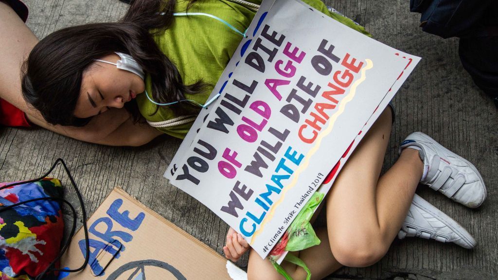 People in Bangkok, Thailand, take part in a die-in, lying on the ground and pretending to die, symbolizing the impact of climate change, in front of the Ministry of Natural Resources and Environment on Sept. 20, 2019. Hundreds participated in a global day to demand action on climate change. The movement was inspired by Swedish teenager and climate activist, Greta Thunberg. (Lauren DeCicca/Getty Images)
