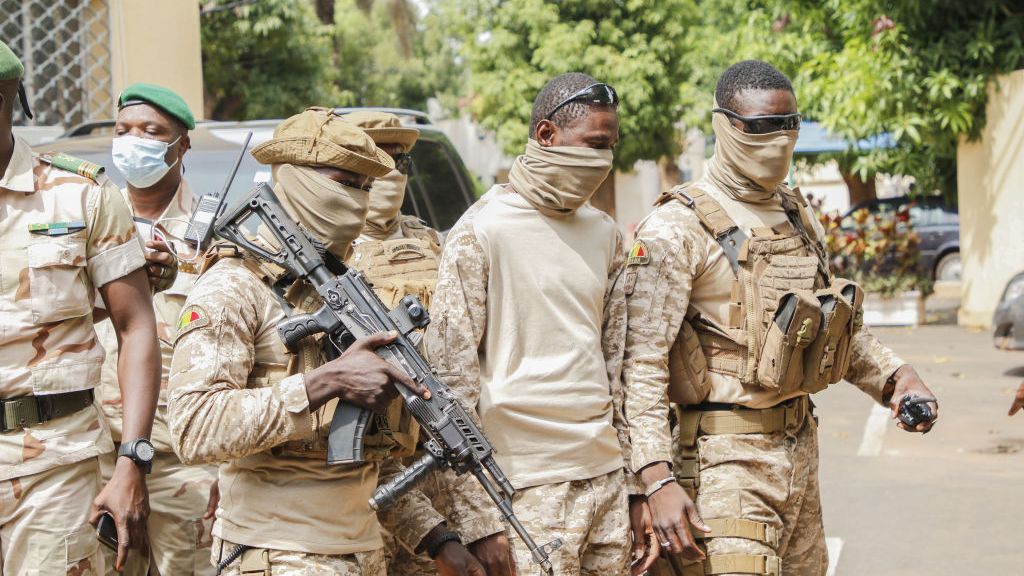 The leaders of the committee that overthrew former Malian President Ibrahim Boubacar Keïta arrive for negotiations with West African leaders in Bamako, Mali, in Aug. 2020. (John Kalapo/Getty Images)