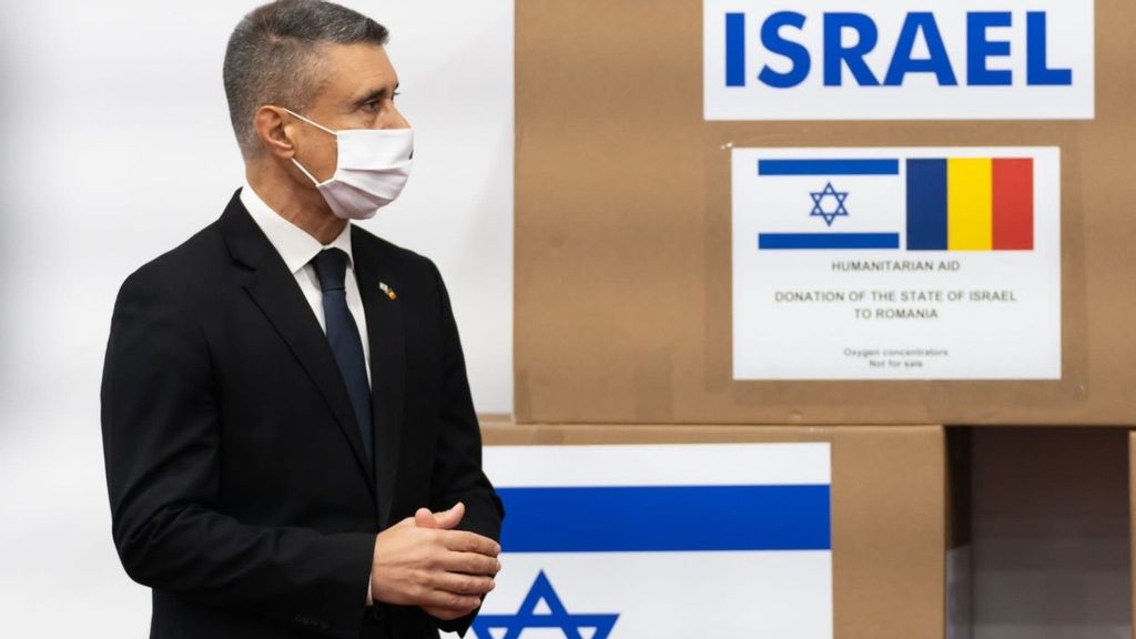 David Saranga, Israeli Ambassador in Romania, with boxes of oxygen concentrators donated by the embassy along with AFI Europe Romania and Elbit Systems Israel. (Courtesy of Israeli Embassy in Bucharest)