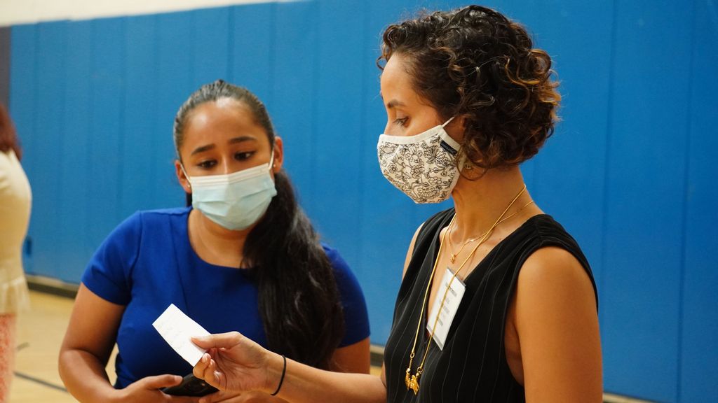 Racial Justice Commissioner Yesenia Mata, left, and Executive Director Anusha Venkataraman talk during a recent session to hear concerns from the public.  (Courtesy of New Yoork City Racial Justice Commission).