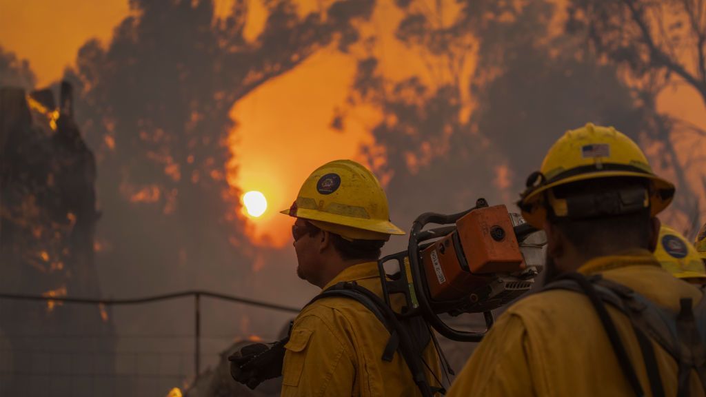 Firefighters battle the Alisal Fire on Oct. 12 near Goleta, California. Pushed by high winds, the fire grew, shutting down the much-traveled 101 Freeway along the Pacific Coast. (David McNew/Getty Images)