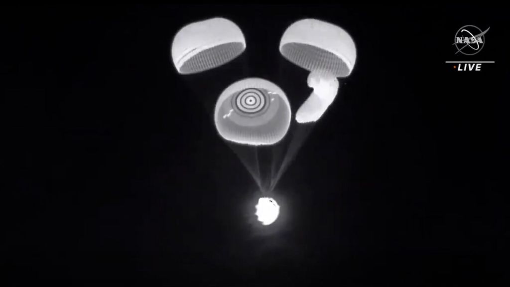 NASA’s SpaceX opens its parachutes as it descends to Earth on Nov. 8. The capsule carried four astronauts that set a record for the longest spaceflight by a U.S.-crewed spacecraft. (NASA/Zenger)