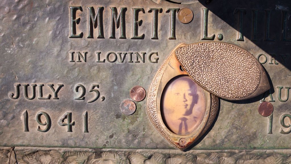 A faded photograph is attached to the headstone that marks the gravesite of Emmett Till in Burr Oak Cemetery in suburban Chicago, Illinois, on March 22. Till's brutal murder in Money, Mississippi in the summer of 1955 and his mother's decision to hold an open-casket funeral to expose the brutality of the murder is credited with igniting the modern civil rights movement. (Scott Olson/Getty Images)