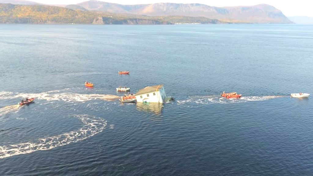 Roughy halfway through its voyage across the Bay of Islands in Newfoundland, Canada, a small hole in the home's base caused it to begin sinking. (Keith Goodyear/Zenger)