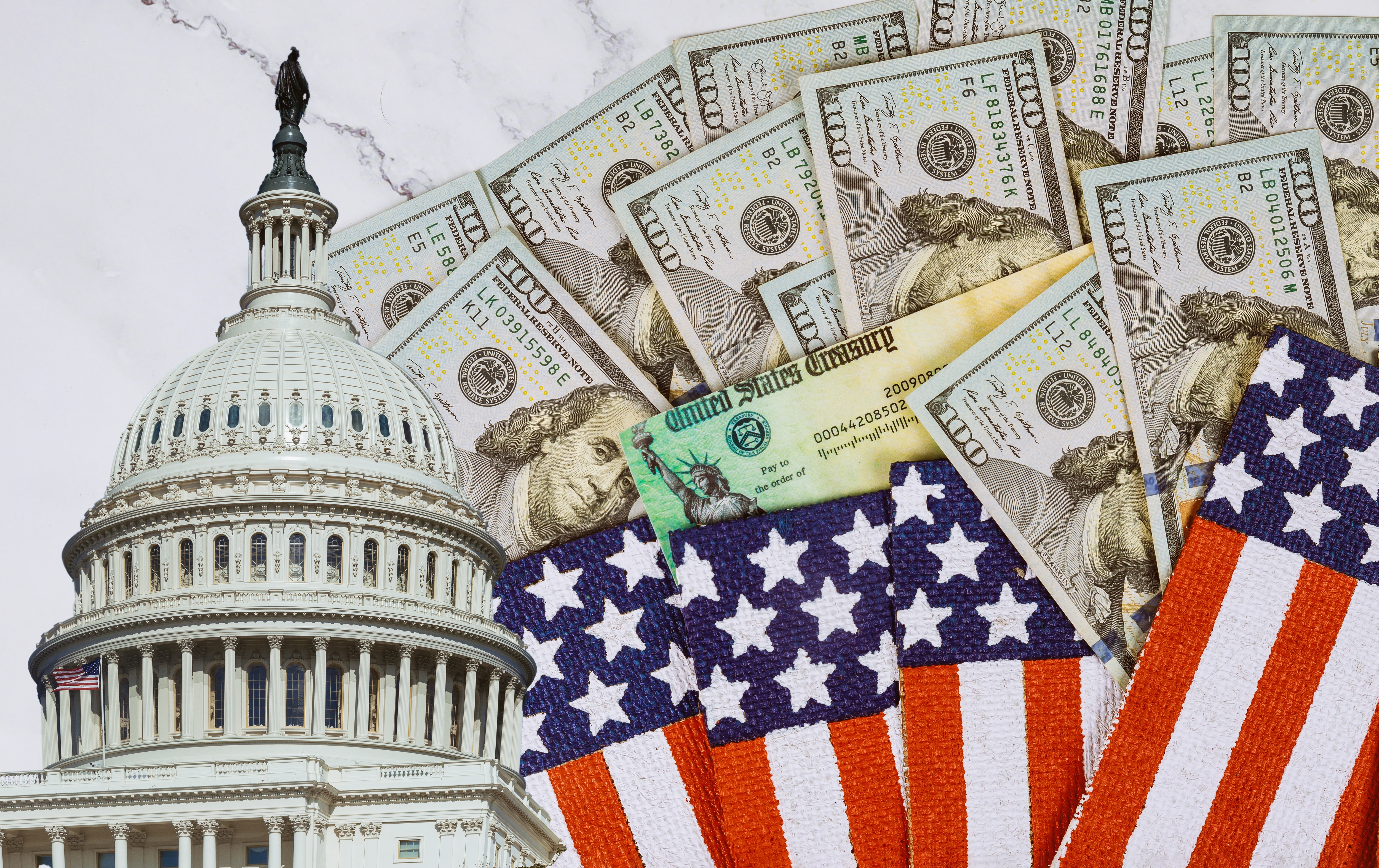 Financial a stimulus bill individual checks from government US 100 dollar bills currency on American flag Global pandemic Covid 19 lockdown