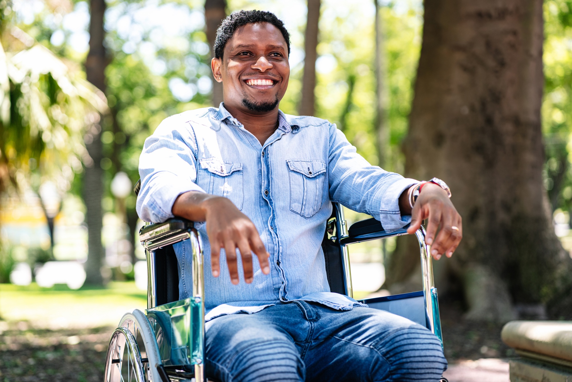 Man in wheelchair at the park.