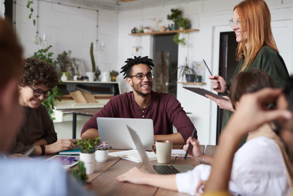 Group of people working together in an office.